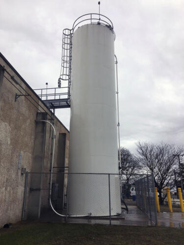 Pressure washing a silo after